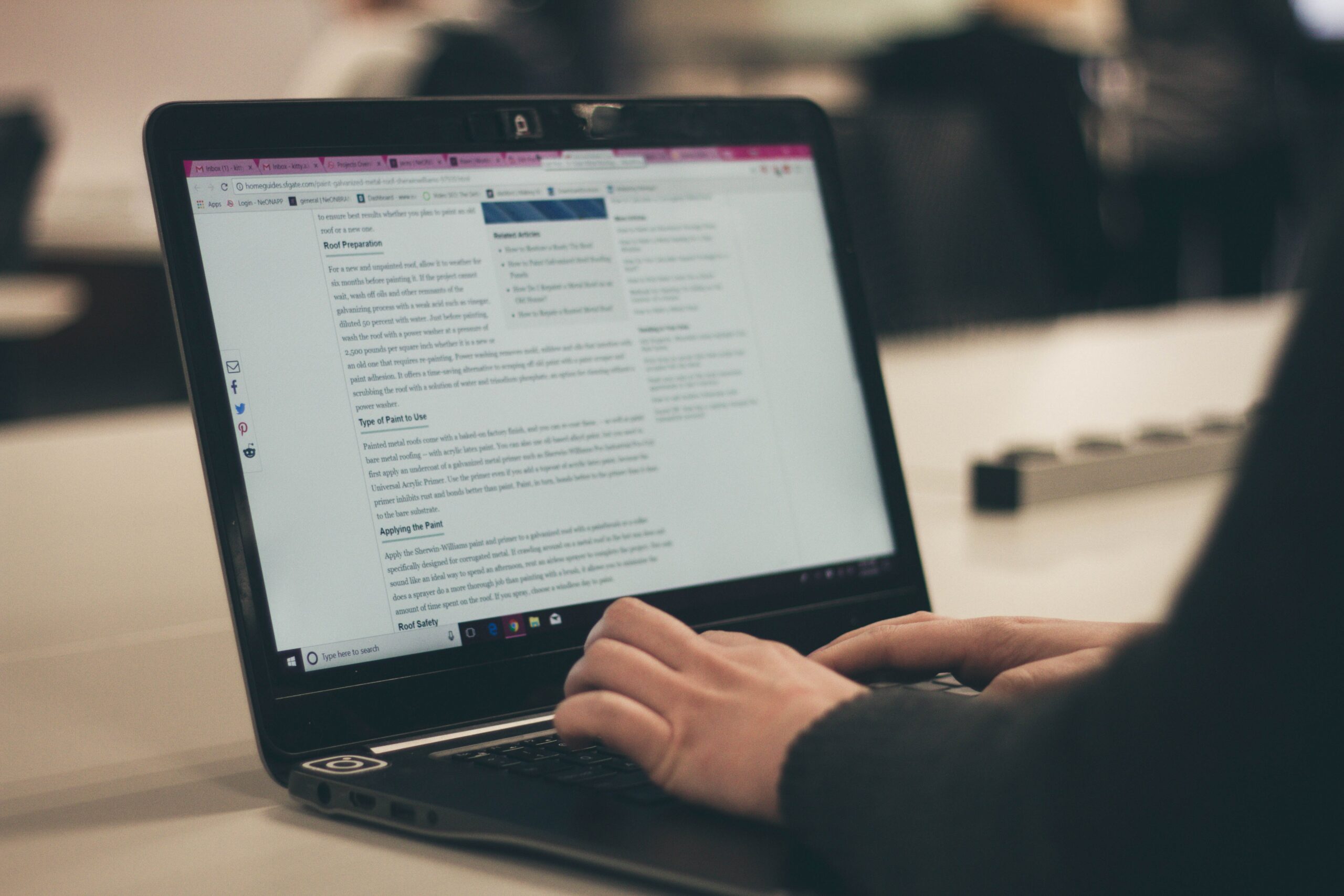 A person at the computer, writing a newsletter to help their press release go further