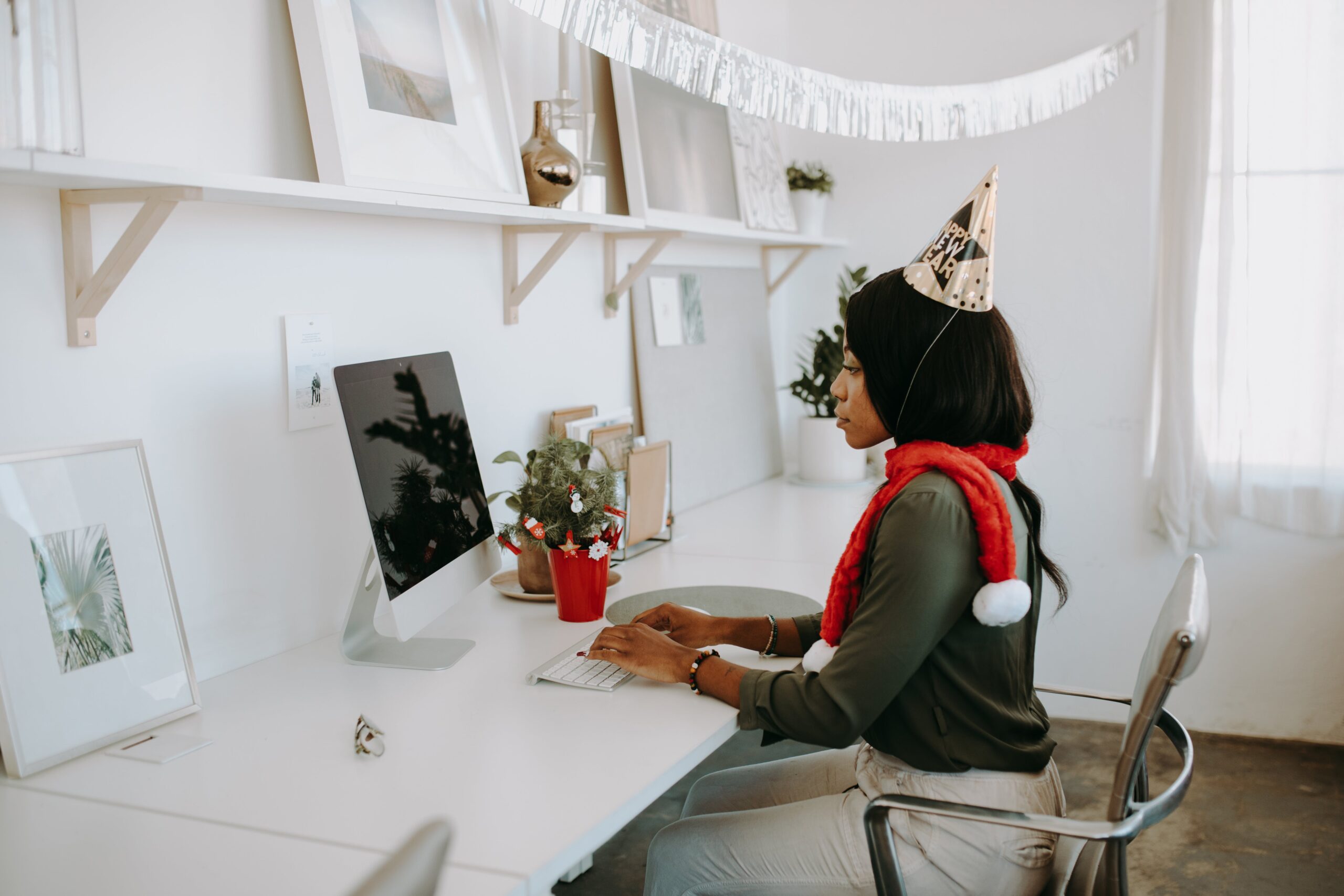 a person sat at a desk writing a Christmas press release