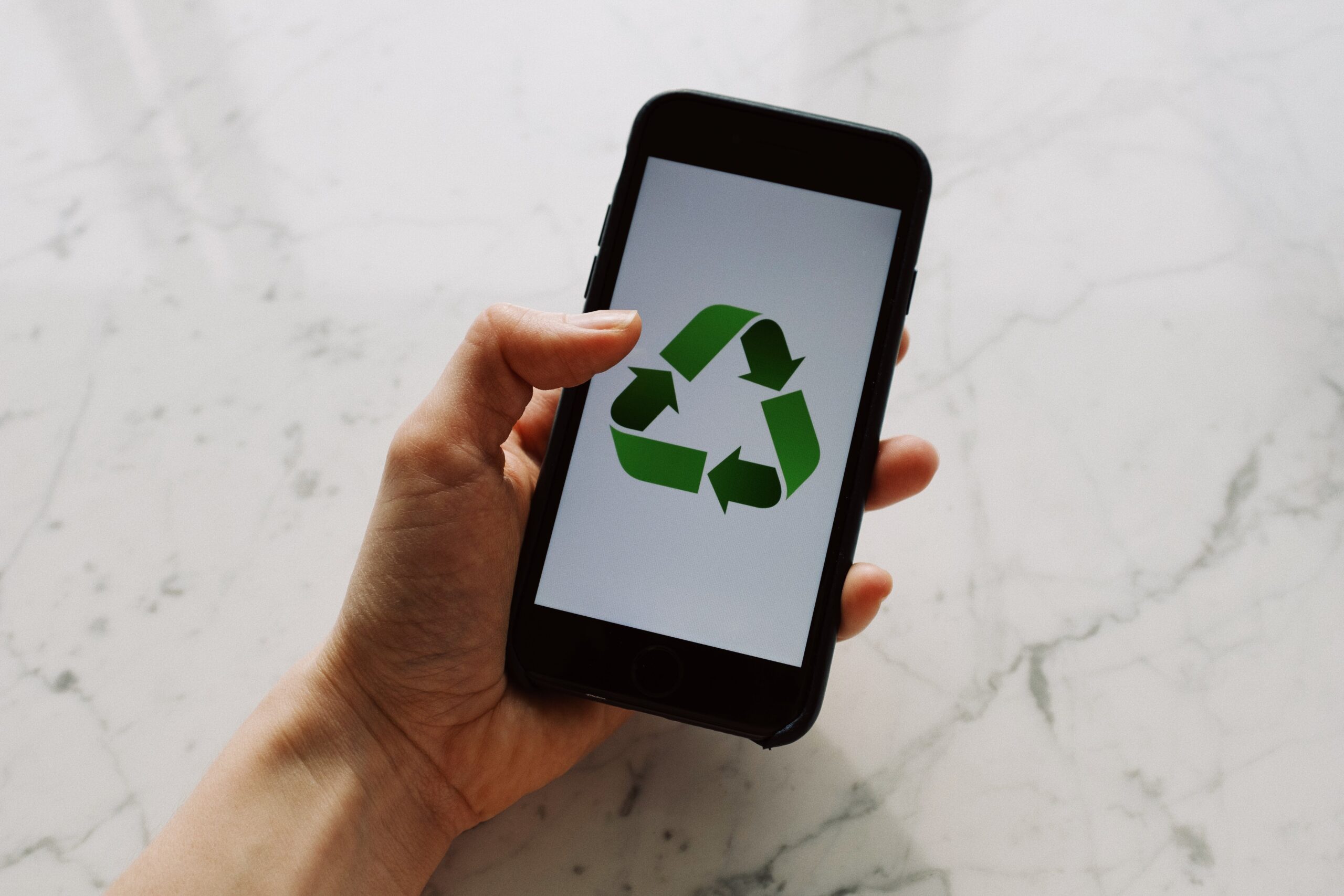 A phone screen showing a Green Initiatives